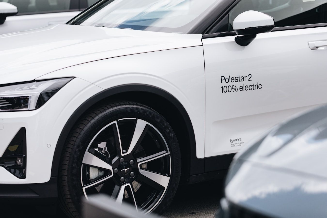 Close-up of the side of the Polestar 2 showing the wheel and the brake