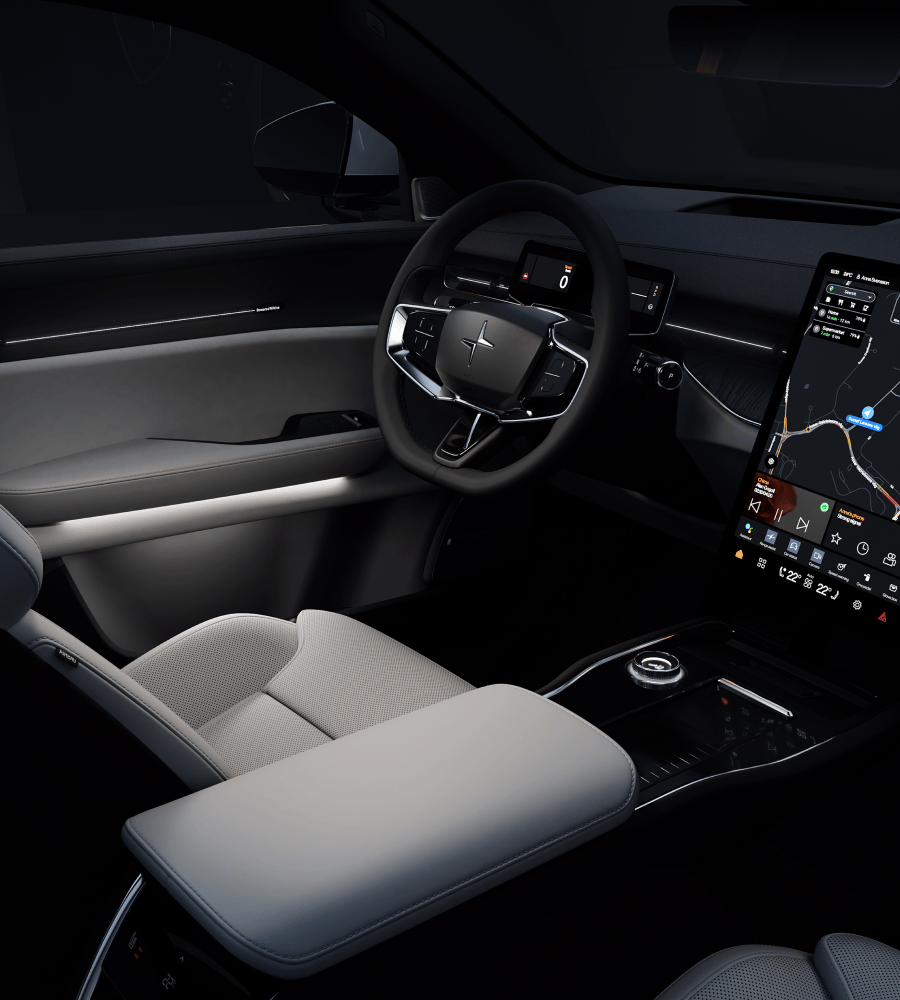 Inside of the car with minimalist white LED lighting integrated into the insturment panel and door sides.