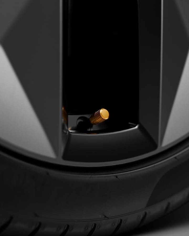 Detailed view of the swedish gold valve caps on the wheel