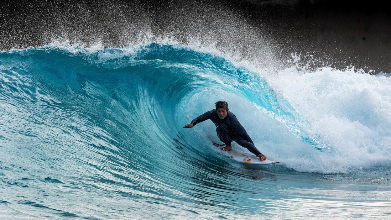 Surfer riding barrel wave