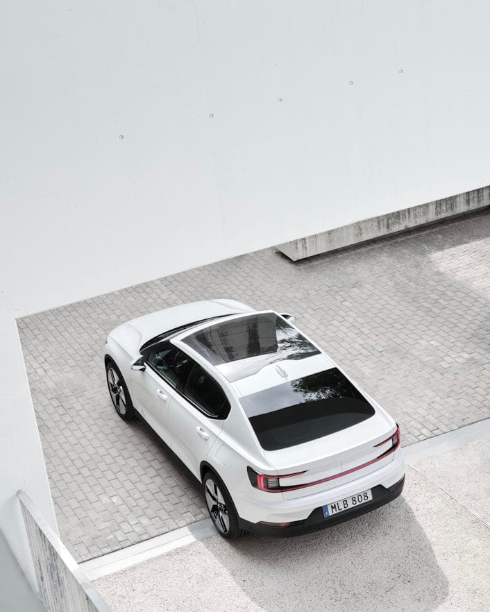 Aerial view of Polestar 2 in Snow color.