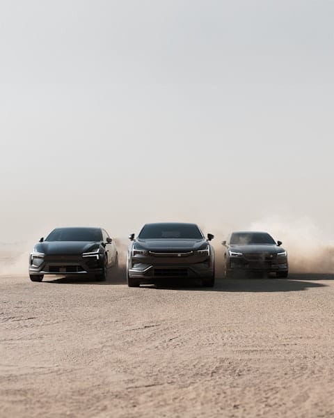 Polestar 2, Polestar 3, and Polestar 4 driving on sand dunes