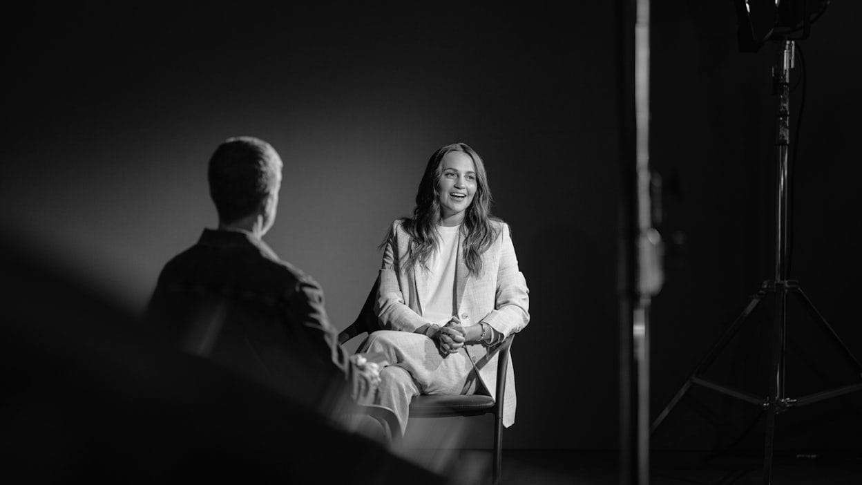 Alicia VIkander interviewed on a chair.