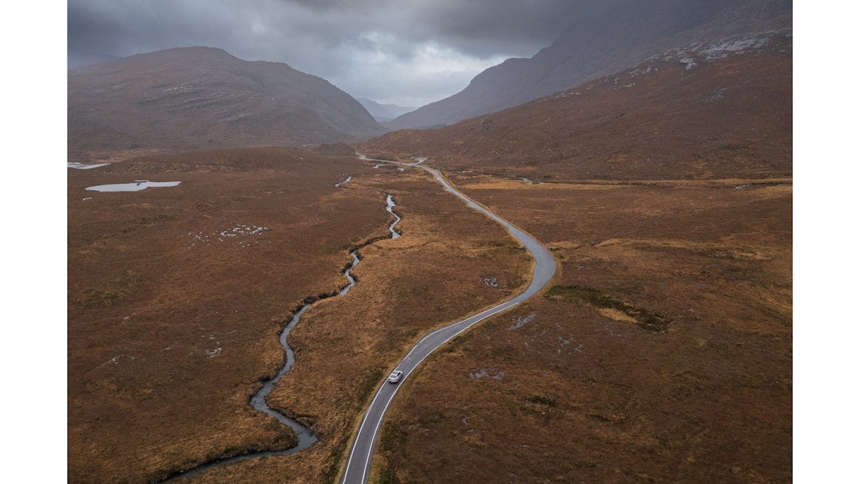 Polestar 2 driving in Scotland from an aerial view