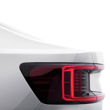 Close-up of Polestar 2 in Snow color, profile view showcasing the rear lights